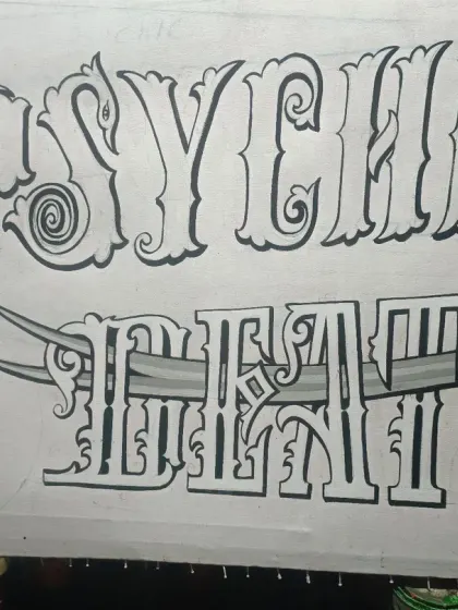 The completed line art for "Psychic Death," ready for color. The design features a sword piercing through the letters, adding a graphic element.