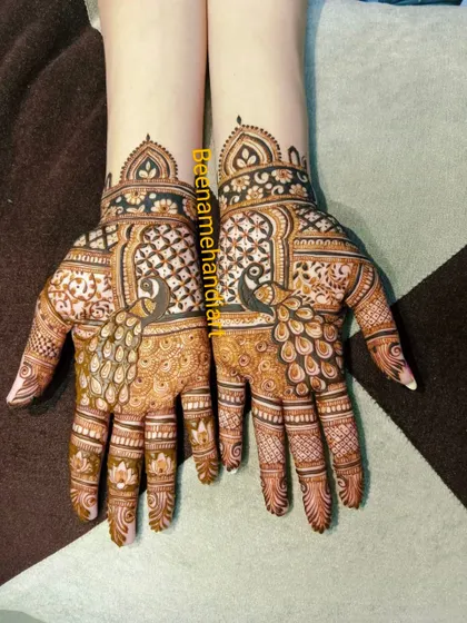 Another angle of the symmetrical peacock mehandi. This shows the detail and consistency across both hands.