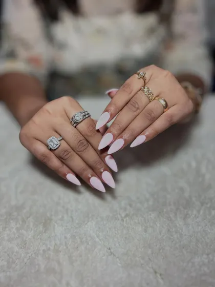 A simple and clean set of light pink stiletto nails. Perfecting nail shaping and solid color application are the most important skills you'll learn.