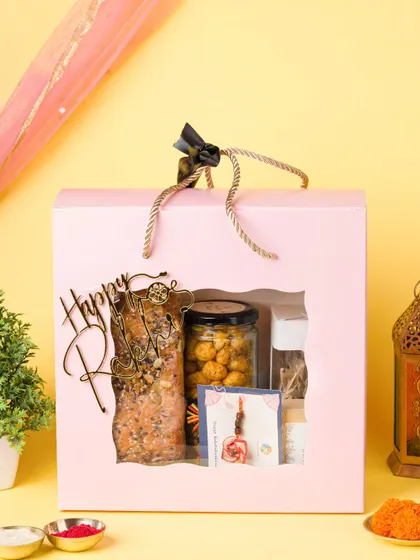 A Rakshabandhan gift hamper for a bakery, styled with traditional elements like a rakhi and roli. We create themed setups for all major Indian festivals.