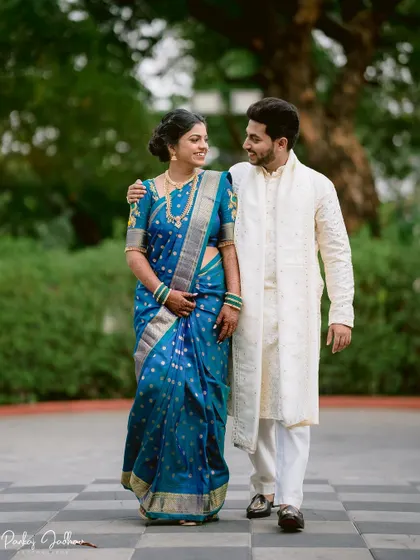 Tanuja and Abhishek walking and talking, a perfect example of a natural, candid engagement portrait.