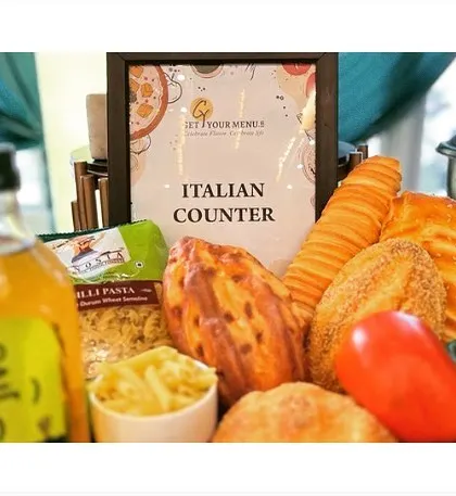 The decor for our live Italian counter, featuring fresh breads, pasta, and vegetables to signal the authentic cuisine being served.