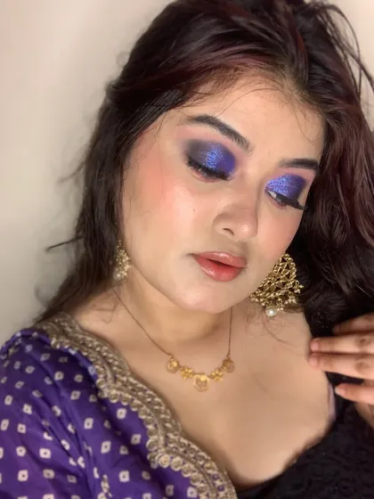 A dramatic purple smokey eye, perfect for a bold evening look.