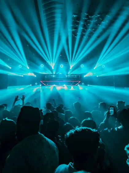 An ocean of people under a canopy of blue laser beams in Nashik. The production on this night was absolutely breathtaking.