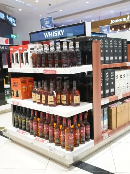 A detailed shot of a whisky aisle in a duty-free store. This type of image is useful for inventory documentation and marketing, highlighting the wide range of products available to customers.