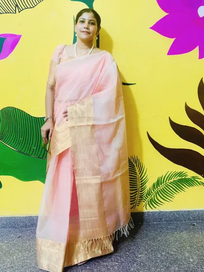 Wearing a beautiful pink and gold saree for Durga Puja. Celebrating Indian festivals is an important part of my life, and I share these moments to connect with my followers on a cultural level.