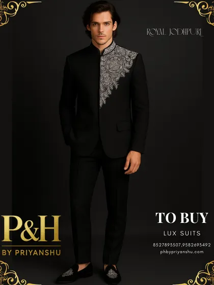 This royal black Jodhpuri suit offers a stark, dramatic elegance. The intricate silver hand-embroidery provides a brilliant contrast against the deep black fabric.
