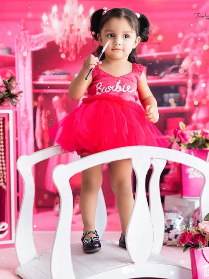 Getting ready to be a little artist with a makeup brush. Our themed shoots, like this Barbie closet, include fun props that encourage imaginative play.