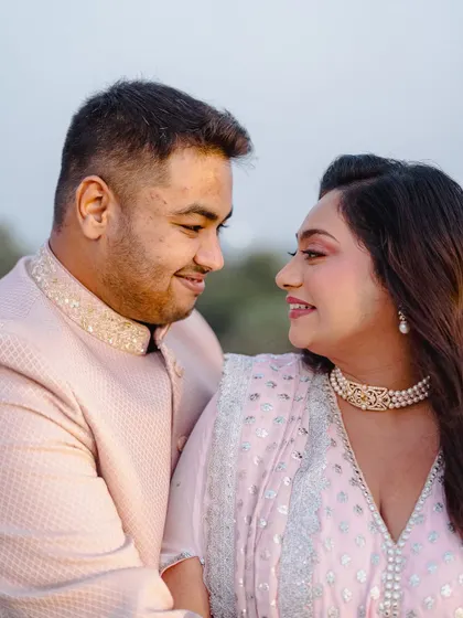 An intimate close-up of the couple, showing the bride's flawless makeup and happy expression.