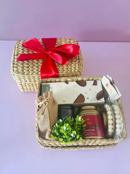 Our Kauna boxes with lids are another sustainable gifting option. This hamper includes cookies, tea, and a pearl t-light holder.