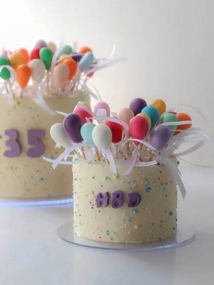 Another shot of the popular balloon cake, a trending design that's easier to create than it looks with our techniques.