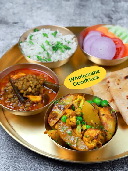 Wholesome goodness is my promise. This thali with aloo gobi matar, whole masoor dal, rice, and roti is a perfect example of a nutritious and delicious everyday Indian meal.
