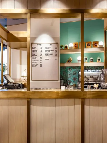 Our coffee and tea bar, with its clean lines, brass accents, and a clear menu, is where your journey into our beverage program begins.