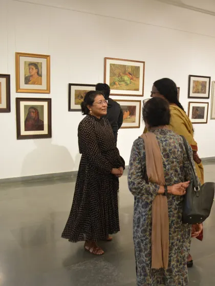 Guests at the preview of the Vidya Bhushan exhibition, enjoying the art and conversation.