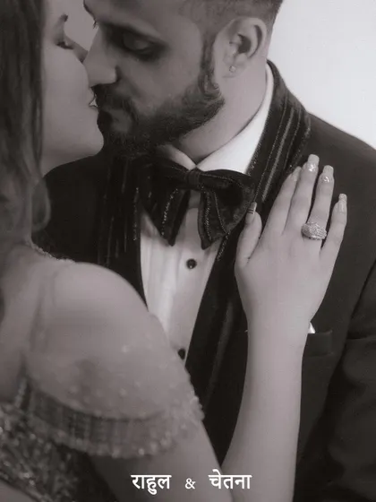 A close-up, black and white shot of the couple sharing an intimate moment, focusing on the emotion and connection between them.