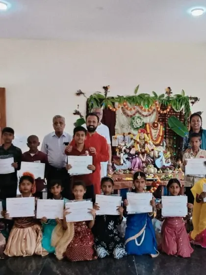 A group photo with the children from a government school after their certificate distribution ceremony. It is our mission to make yoga accessible to every part of the community.