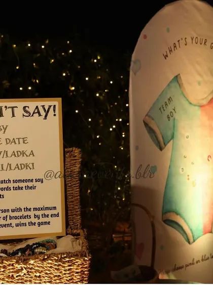 Fun and interactive games at a baby shower. This image shows a "Don't Say Baby" game sign and a "What's Your Guess?" gender reveal prop, highlighting how I incorporate entertainment into the event.