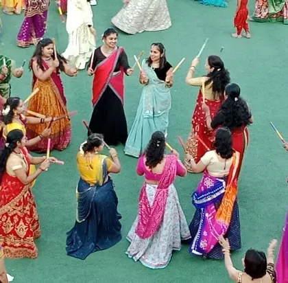 A close-up of the Dandiya dance, capturing the energy and colorful attire of the participants.