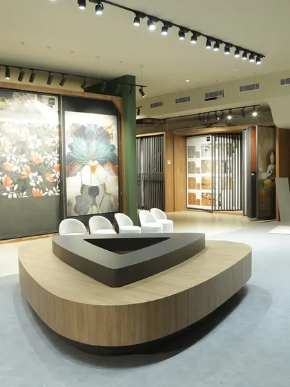 A view of my showroom, where large-scale portrait and floral art murals are displayed. This demonstrates how custom tile art can be used to create dramatic, gallery-like feature walls that command attention and express a bold aesthetic.