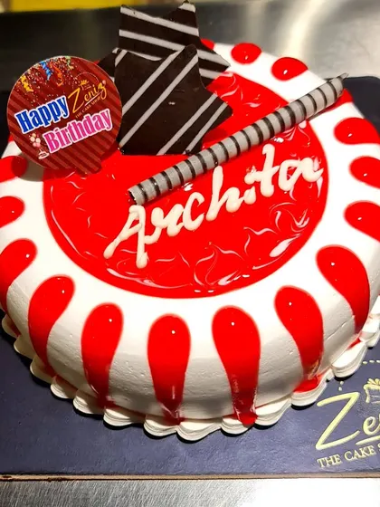 A classic strawberry cake with a bright red glaze and a simple, elegant design. It's a light and fruity option for any birthday.