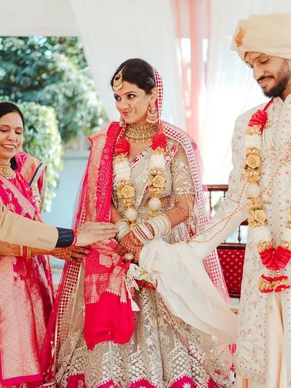 A parent gives his blessing to the couple, a significant moment of family union.