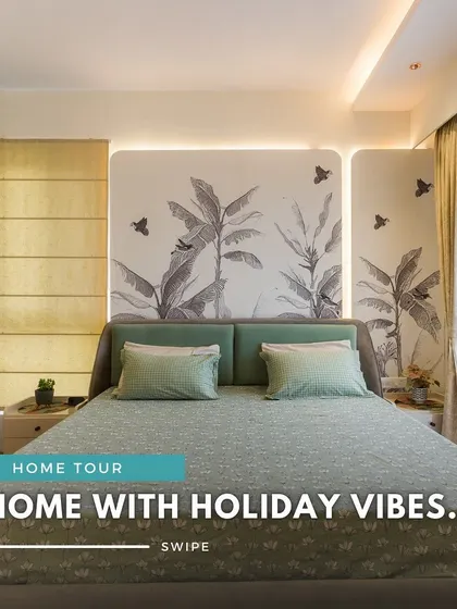 The main image for the "holiday vibes" home tour, featuring a serene bedroom with a coastal theme, complete with palm tree wallpaper and soft green accents.
