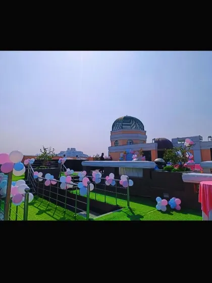 Another view of the rooftop venue, showing how simple balloon decorations can transform an open space.