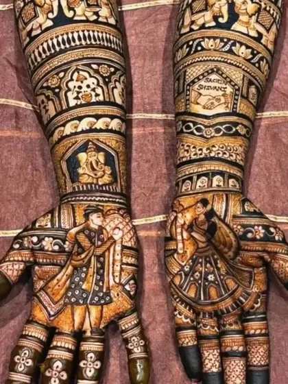 A classic Rajasthani bridal design with detailed figures of the bride and groom, Ganesha, and traditional elephant motifs.