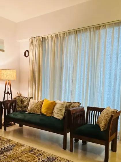 This living room is what dreams are made of. Our Caramel curtains paired with Trailing Berries sheer drapes create a warm, elegant look, perfectly complementing the dark wood furniture and neutral tones.