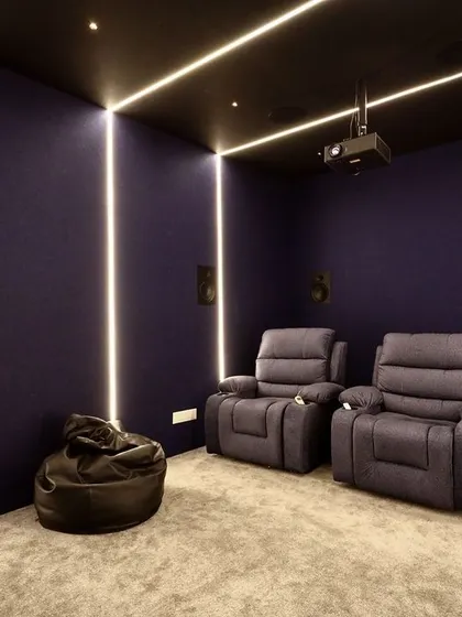To add seating flexibility in this compact room, I included a comfortable bean bag chair alongside the two main recliners.