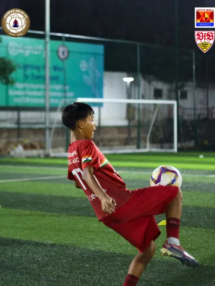 A young player shows off his flair, controlling the ball with his thigh. We encourage our players to be creative and confident on the ball.