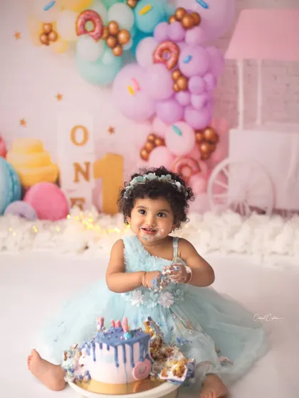 This little darling is celebrating one with the sweetest, most beautiful smile. Her donut-themed party was full of color, joy, and of course, lots of yummy cake.