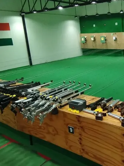 The range is set up and ready for a day of shooting. You can see the individual lanes, shooting benches, and the targets in the distance.