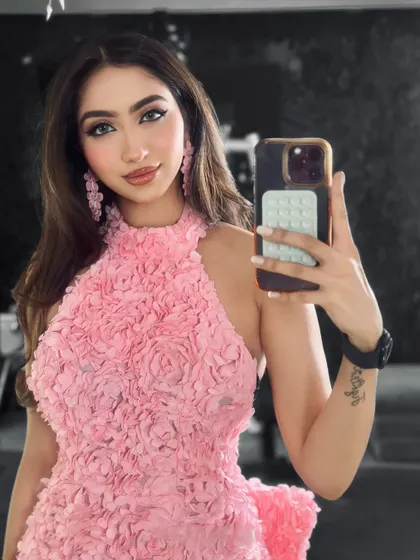 A selfie showing off the finished Arabian-inspired glam look. The sharp liner and soft pink tones come together for a stunning result.
