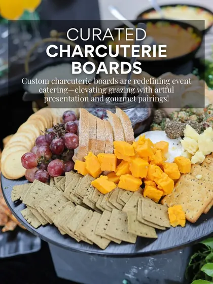 Our curated charcuterie boards are a cornerstone of modern event catering. This board highlights a balanced selection of cheeses, crackers, and fresh grapes, artfully arranged for both visual appeal and gourmet pairing.