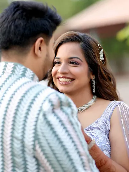 Capturing the pure joy of an engagement day. This candid moment shows how the right makeup enhances your happiness. Her radiant smile is highlighted by a soft glam look with a pop of color on the eyes, ensuring she looked and felt her best.