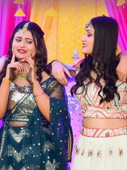 The bride shares a laugh with her bridesmaids during the Mehndi function. We specialize in candid photography that captures the true spirit of your celebrations.