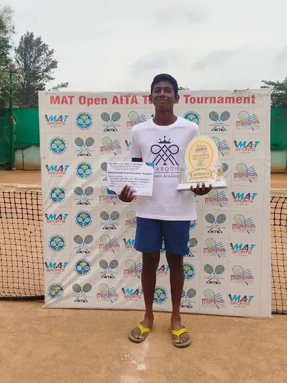 Another trophy for the cabinet. Our player proudly displays his runner-up trophy from the AITA U-16 Championship. Every tournament is a learning experience on the path to becoming a champion.