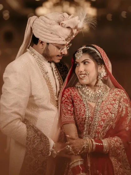 A sweet and intimate portrait of the bride and groom, sharing a loving look on their wedding day.