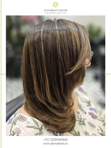 A bold and beautiful brunette look, with expertly placed highlights and a fresh cut to create a polished, modern style.