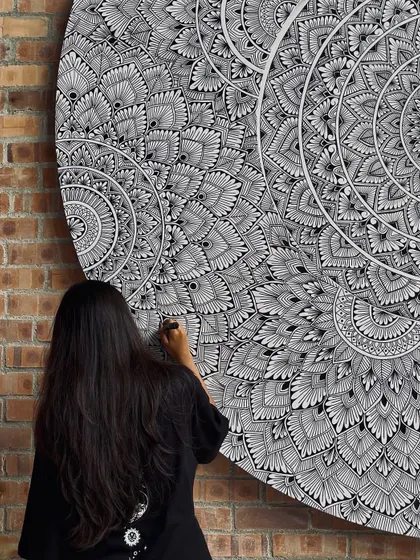 A close up of the freehand line work on the large circular board for the Kuala Lumpur mural. The beauty is in the imperfection of each hand drawn line.