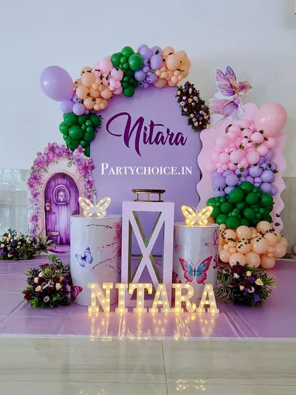 A clear shot of the fairy-themed stage, with its whimsical props, marquee letters, and colorful balloon arrangements.