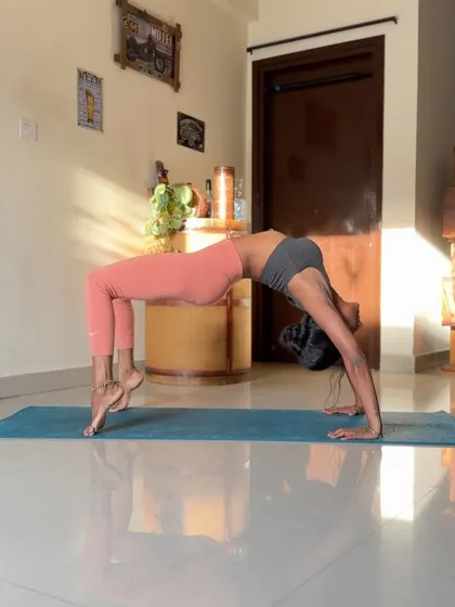 Another shot of Wheel Pose, this time with a focus on the arch of the spine and the opening of the shoulders.