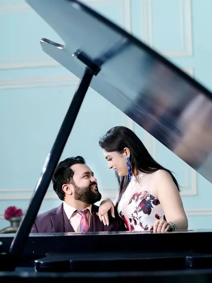 For a touch of classic elegance, we offer indoor setups like this one with a grand piano. It's a sophisticated option for pre-wedding or portfolio shoots.
