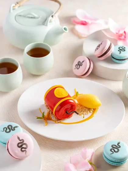 An elegant dessert and tea pairing at Yautcha. The clean, bright styling communicates a sense of refinement and artistry.
