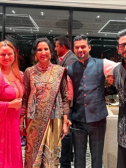Posing with the lovely hosts and guests at the Jhunjhunwala Diwali party. Every guest is important, and I make sure to connect with everyone.