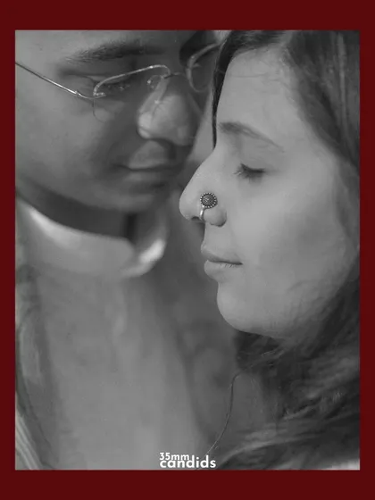 A close-up, black and white portrait of the couple. The intimacy and soft focus create a timeless and emotional feel.