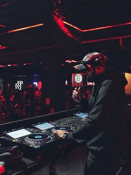 Same moment, different vibe. The focus is intense when you're blending tracks for a festival crowd.
