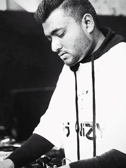 A portrait of me locked into the music. My DJ mentorship is built on a foundation of deep love for the craft, which I aim to share with every student.
