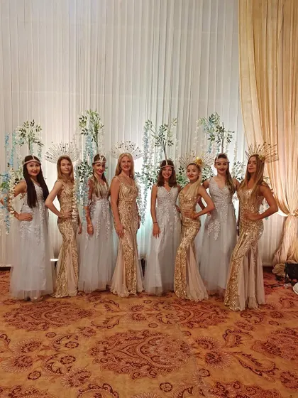 A duplicate image of our international hostesses and dancers in their stunning gold and silver gowns.